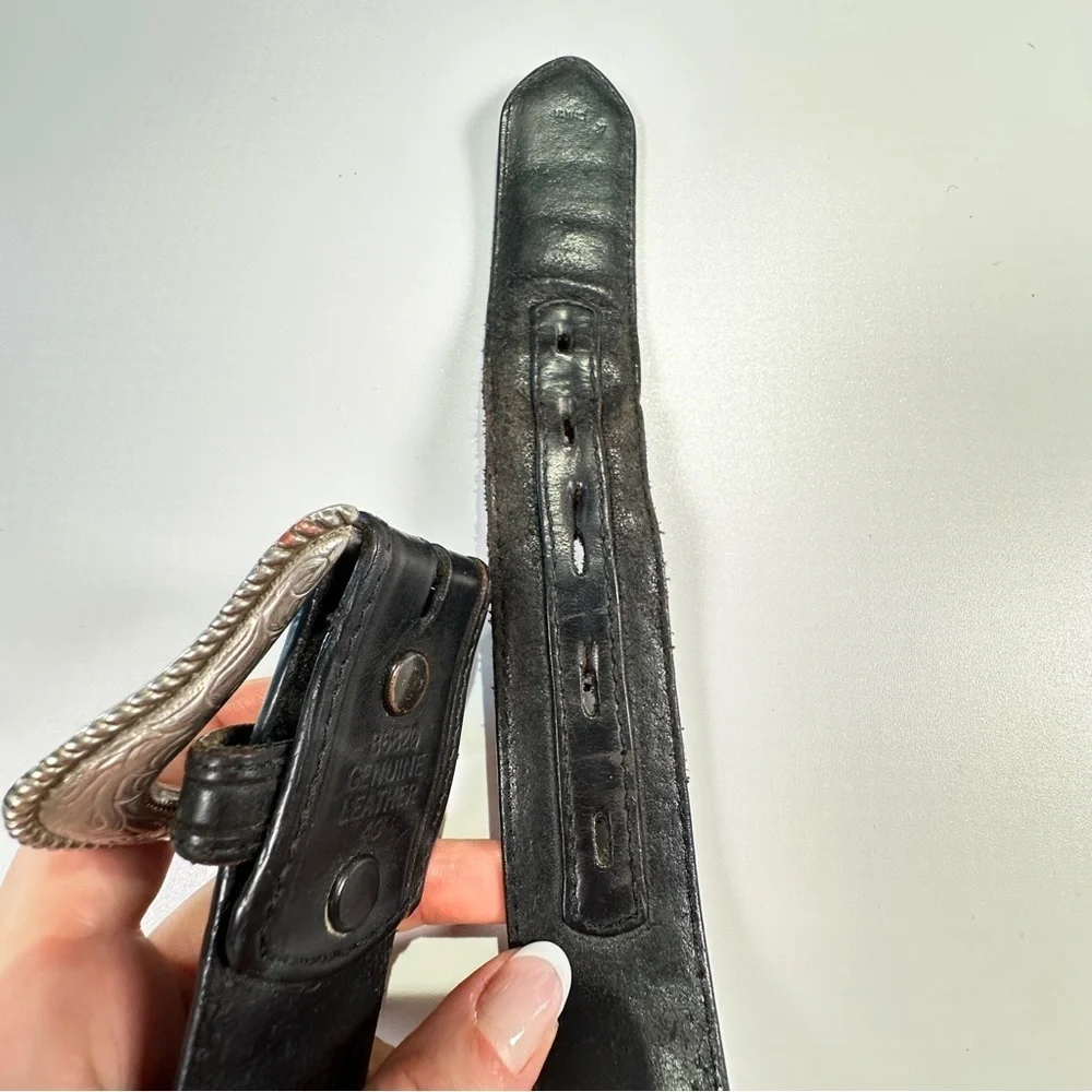 Black Leather Belt with Intricate Silver Buckle